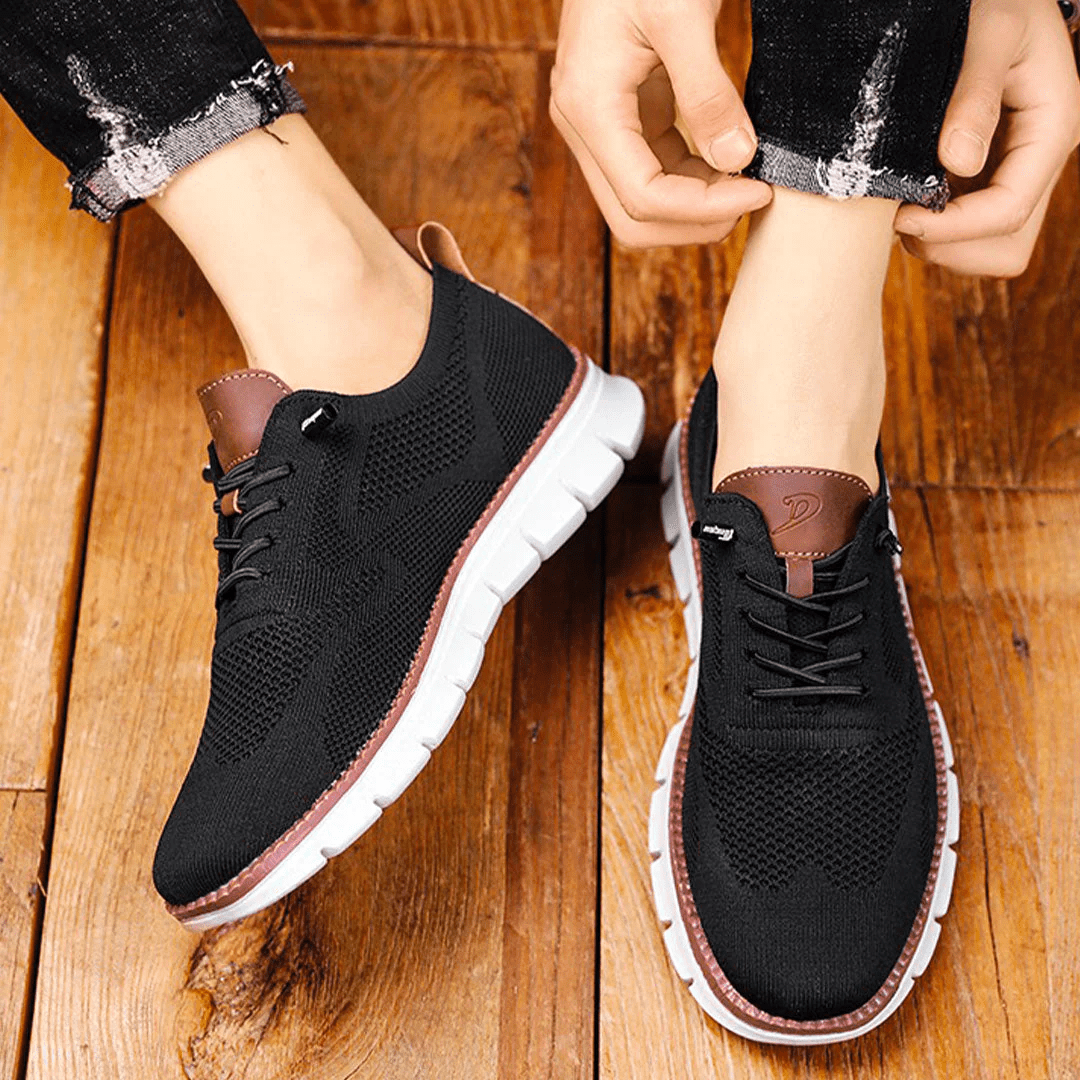 Stylish men's perforated sneakers with a round toe and lace-up closure for everyday fashion.