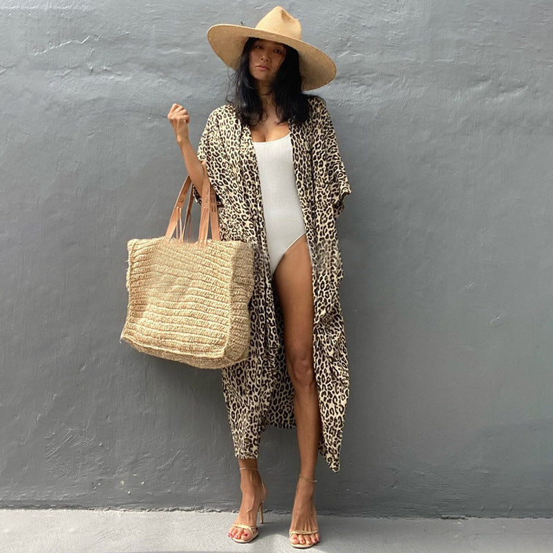 Flowy women's swimsuit cover, stylish sun protection beachwear for your next vacation.