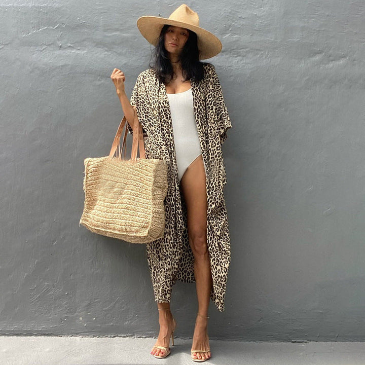 Flowy women's swimsuit cover, stylish sun protection beachwear for your next vacation.