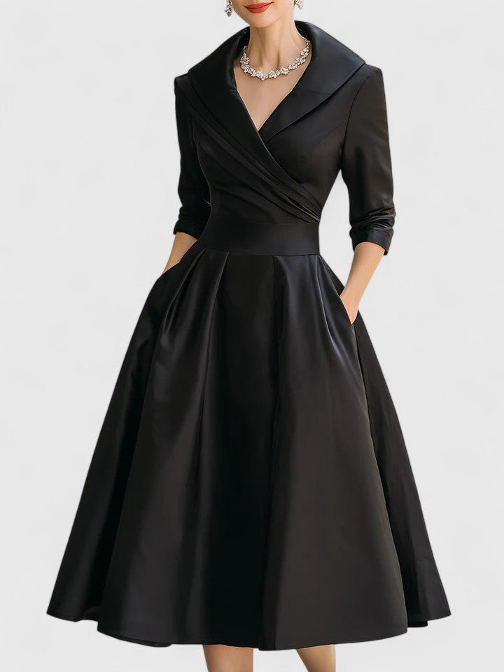 Side view of a flowy women's pleated flared midi dress with a wrap design, ideal for summer or autumn events.