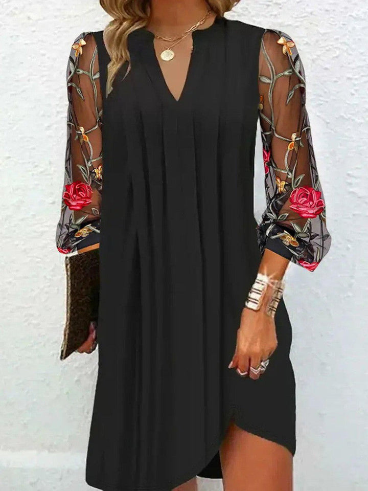 Timeless women's elegant black dress with stunning floral embroidered V-neck design, perfect for formal occasions.