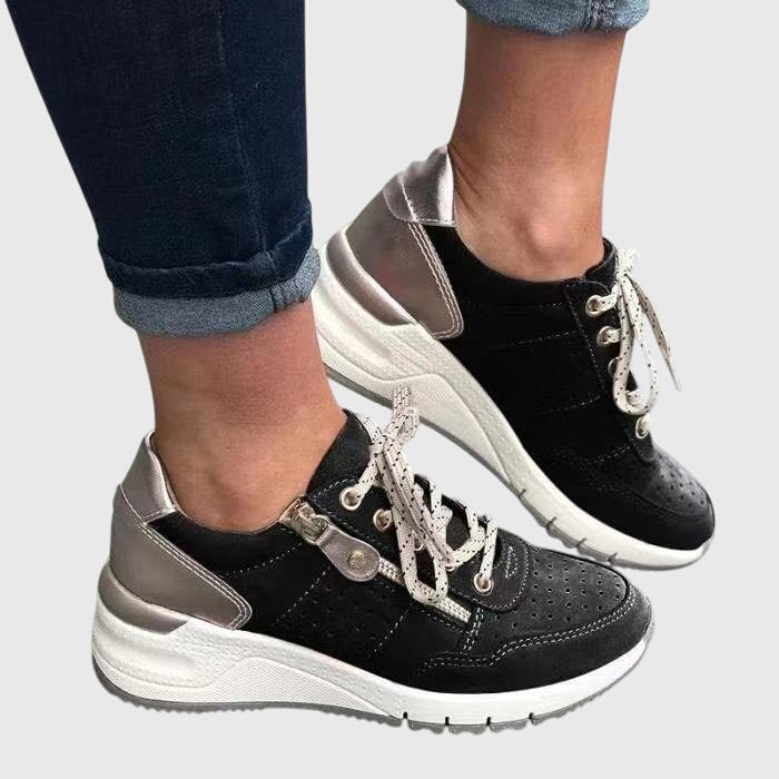 Athletic women's orthopedic sneakers, non-slip design for comfort, support & pain relief during walking.