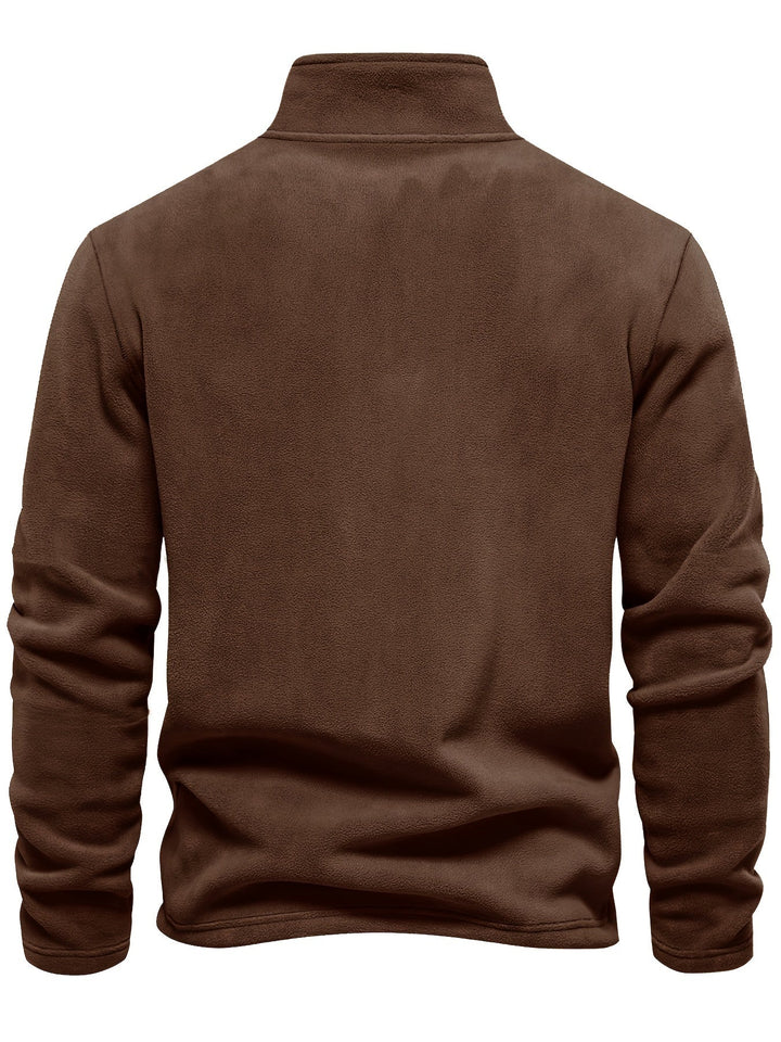 Stay warm and cozy in this unisex fleece half-zip pullover. A winter essential for chilly days & comfort.
