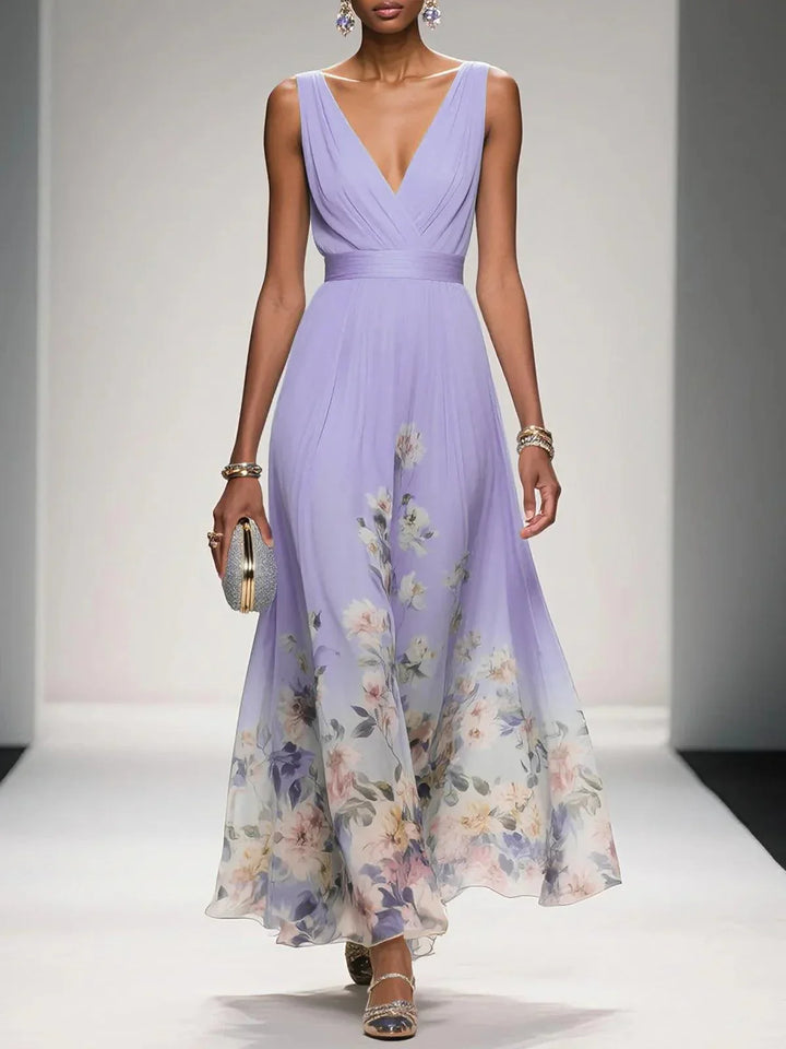 Elegant woman wearing a beautiful V-neck floral maxi dress, perfect for summer fashion.