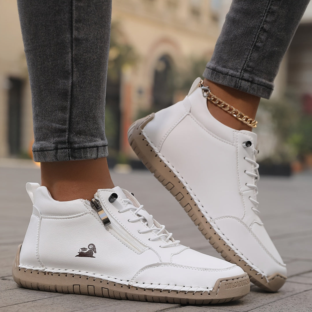 Women's supportive high-top sneakers, featuring a convenient zip and adjustable laces.