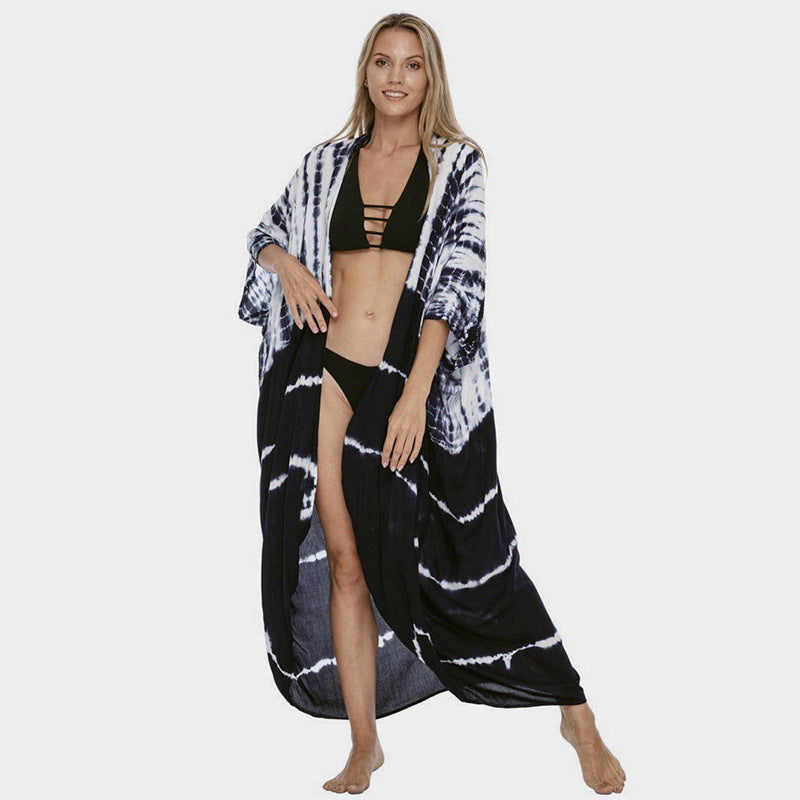 Glamorous women's beach cover up, stylish sun protection, perfect for a chic summer dress.