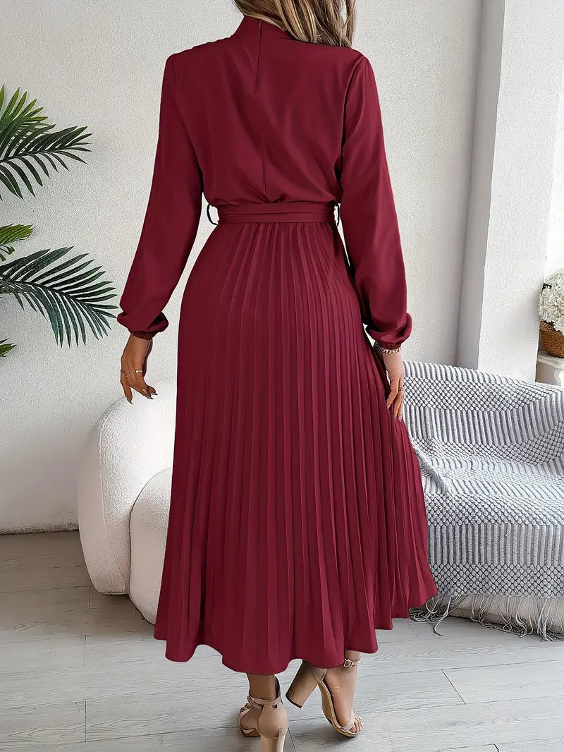 Stylish women's work dress: long-sleeve, belted, pleated midi style.