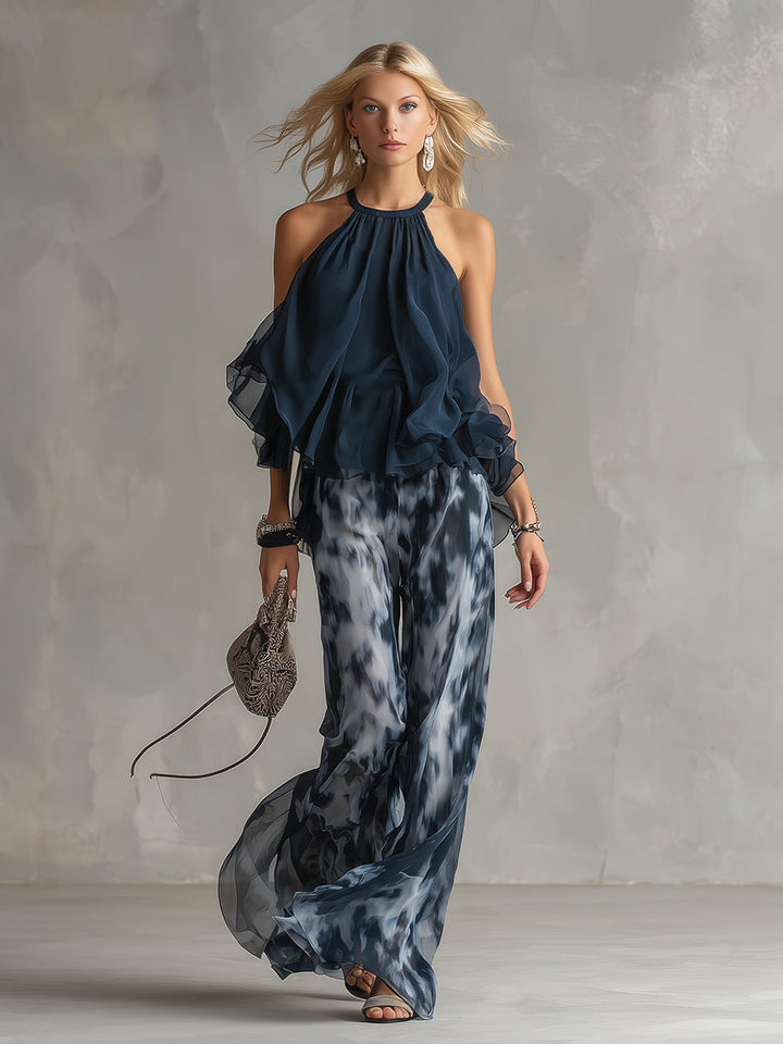 Effortless navy blue women's casual chic two-piece outfit featuring a modern turtleneck top and wide-leg trousers.