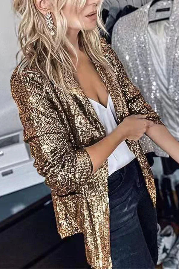 Women's fashion blazer with sparkling sequin lapels. Elegant long sleeve jacket for glamorous evening wear.