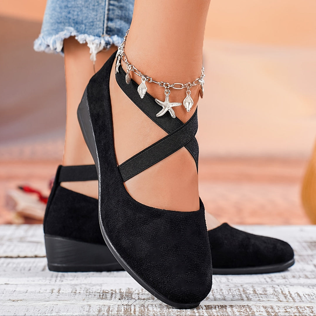 Elegant women's flat wedge sandals, offering comfortable support for spring fashion & stylish summer footwear.