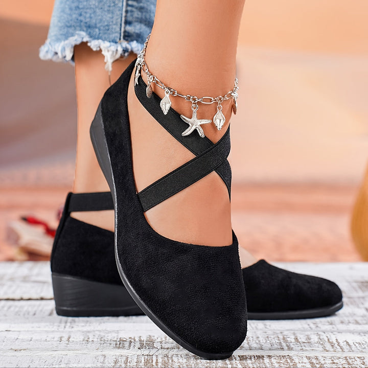 Elegant women's flat wedge sandals, offering comfortable support for spring fashion & stylish summer footwear.