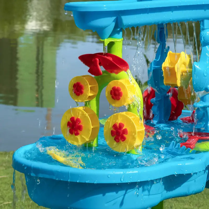 Close-up of the Splash Fun Water Table's interactive water wheels, boats, and accessories for endless play.