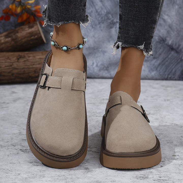 Women's casual platform clogs with a secure, adjustable closed-toe design.