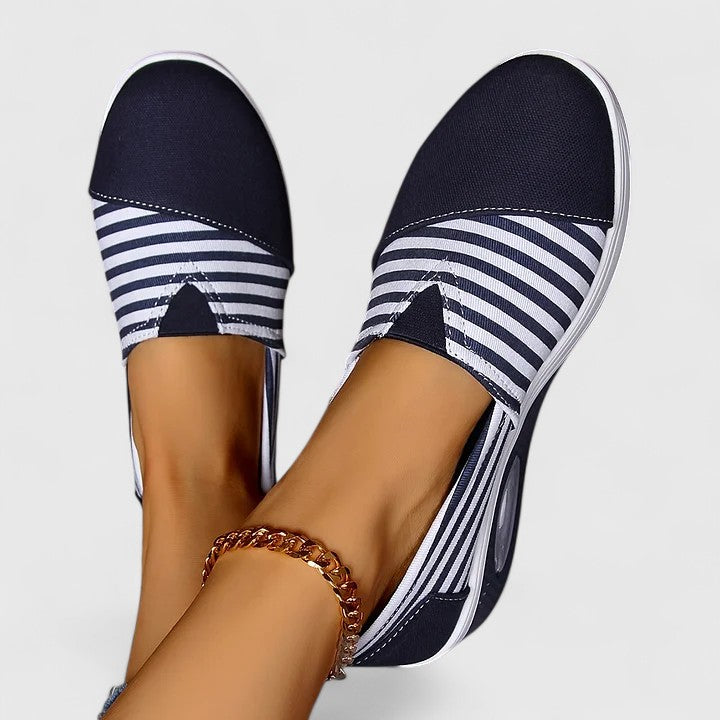 Side profile of women's slip-on comfort sneakers, designed for supportive orthopedic walking.