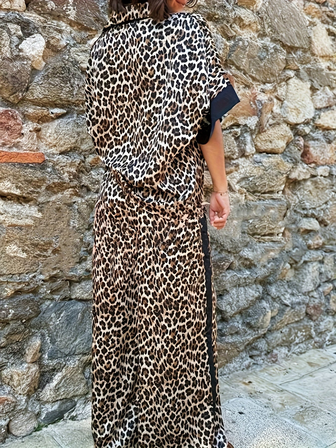 Women's sophisticated two-piece collared top & wide-leg trousers set. Versatile elegant coordinated outfit.