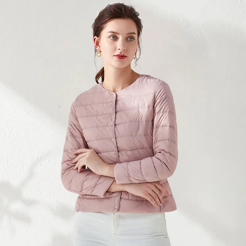 Everyday women's lightweight puffer jacket. Collarless and slimming, ideal for transitional weather outerwear.