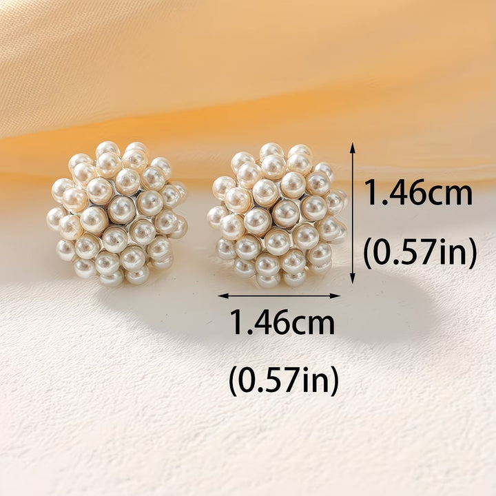 Stylish women's pearl dome stud earrings. Hypoallergenic and timeless elegant jewelry design.