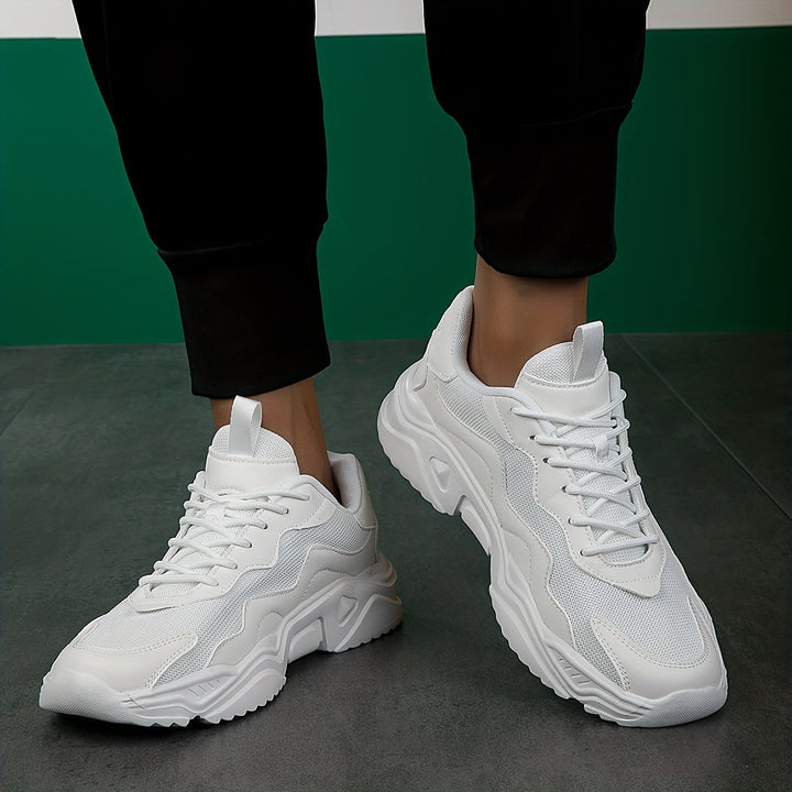 Stylish men's casual sneakers, lace-up design for a secure fit. Comfortable urban sport shoes for daily use.