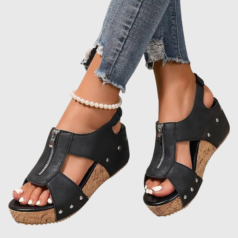 Stable walking sandals for women with orthopaedic comfort, arch support, and convenient zipper closure.