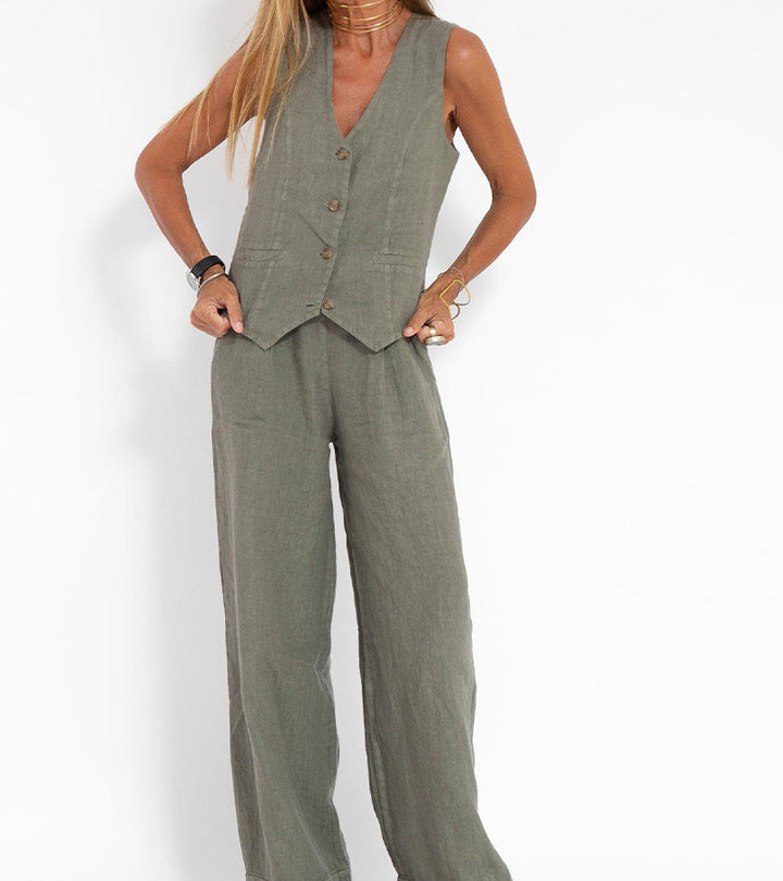 Details of the fabric and cut of the elegant women's sleeveless V-neck top and wide-leg trousers set.