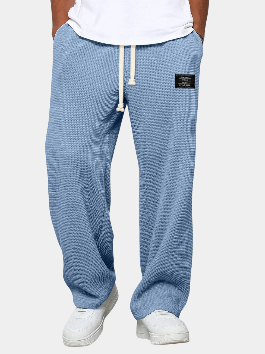 Men's relaxed fit everyday trousers in neutral, comfortable fabric. Ideal for casual versatile style.
