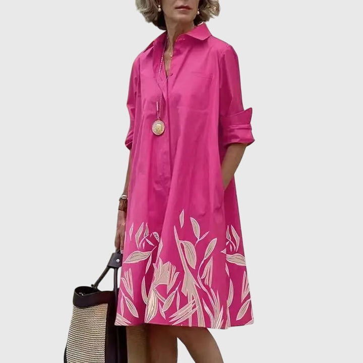 Model sitting comfortably in a versatile everyday dress, emphasizing its ease of wear and style.