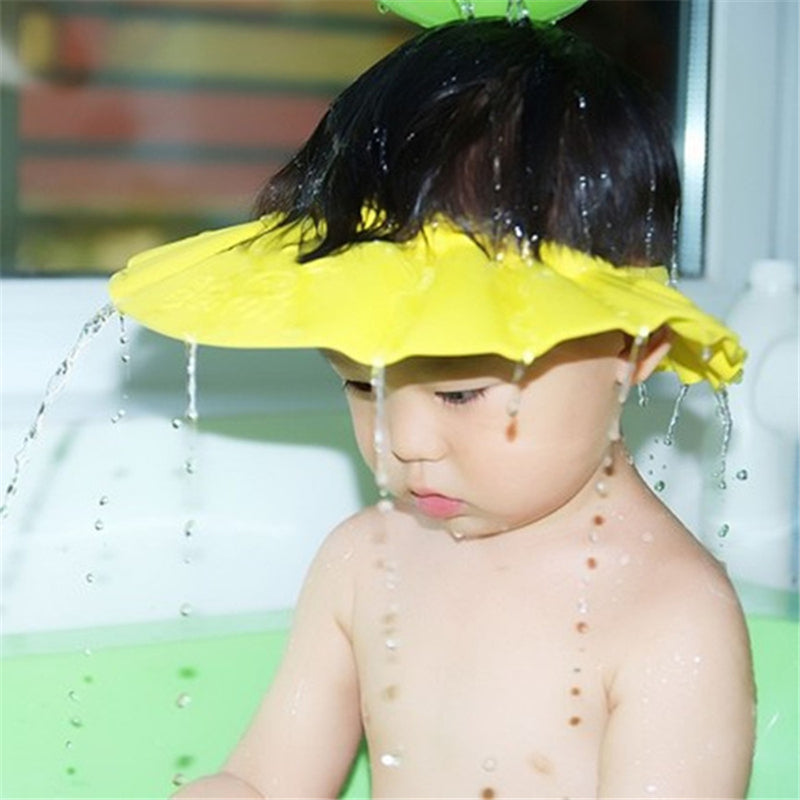 Soft silicone adjustable baby shampoo cap for tear-free baths, protecting eyes & ears of infants.