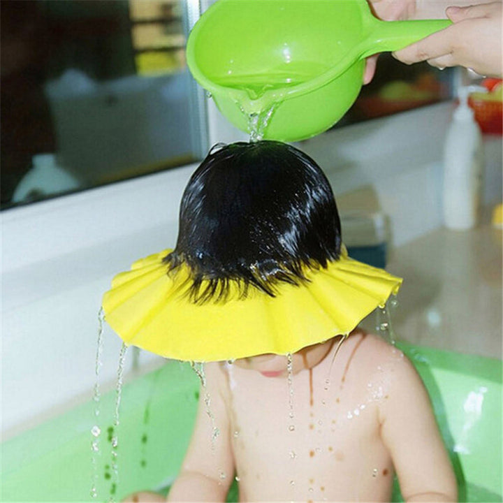 Tear-free baby shampoo cap with ear flaps and eye shield for comfortable bath time, adjustable for kids.