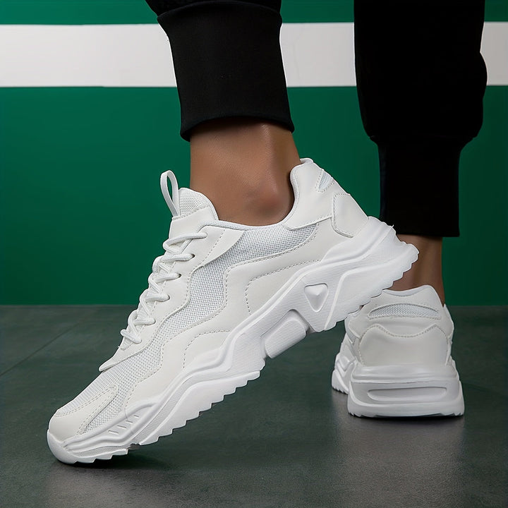 Classic men's fashion sneakers, versatile for casual outfits. Lace-up urban footwear for everyday style.
