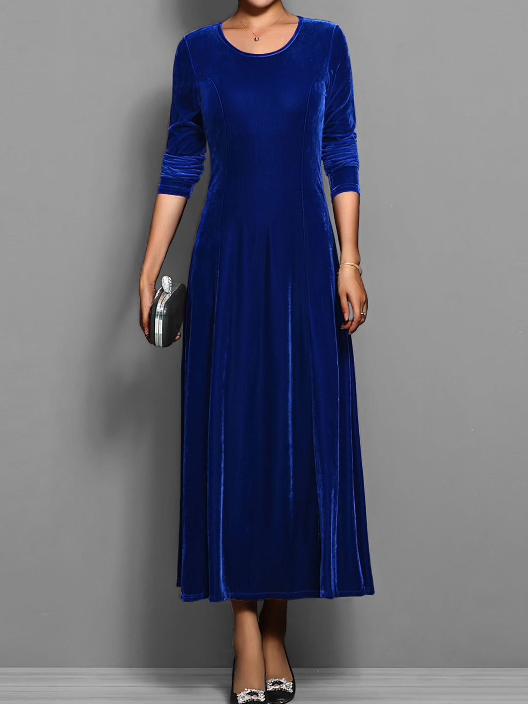 Elegant women's full-length flared maxi dress with long sleeves & round neck, perfect for evening wear.