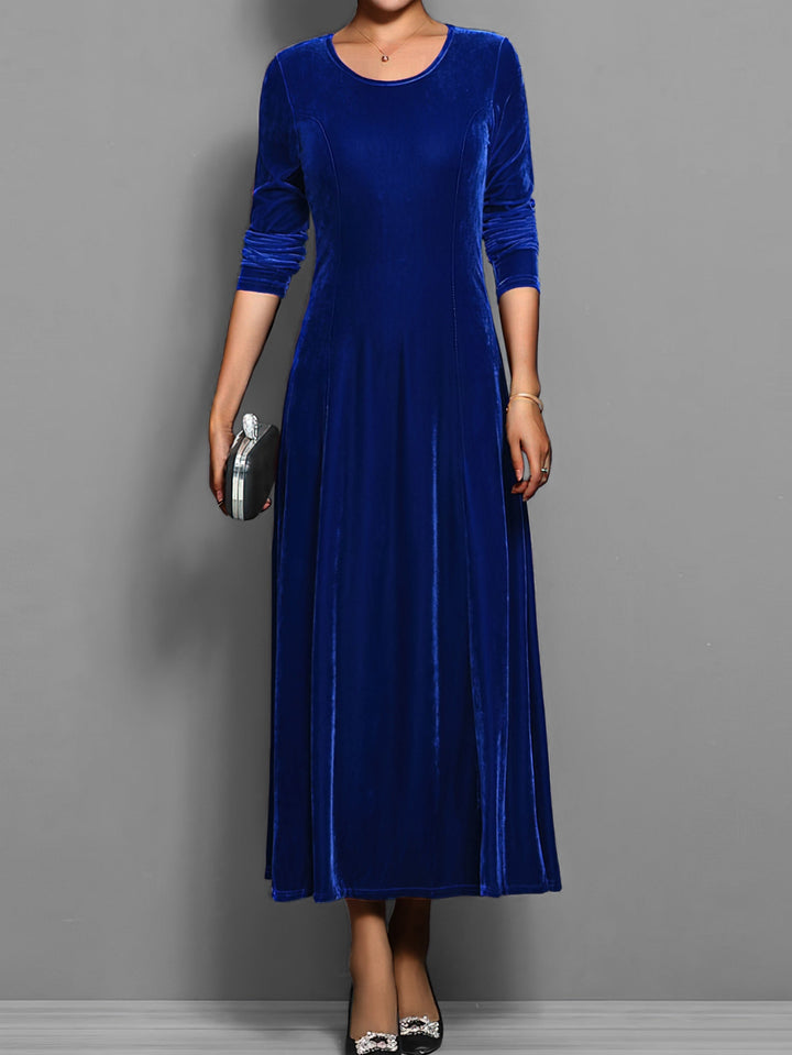 Elegant women's full-length flared maxi dress with long sleeves & round neck, perfect for evening wear.