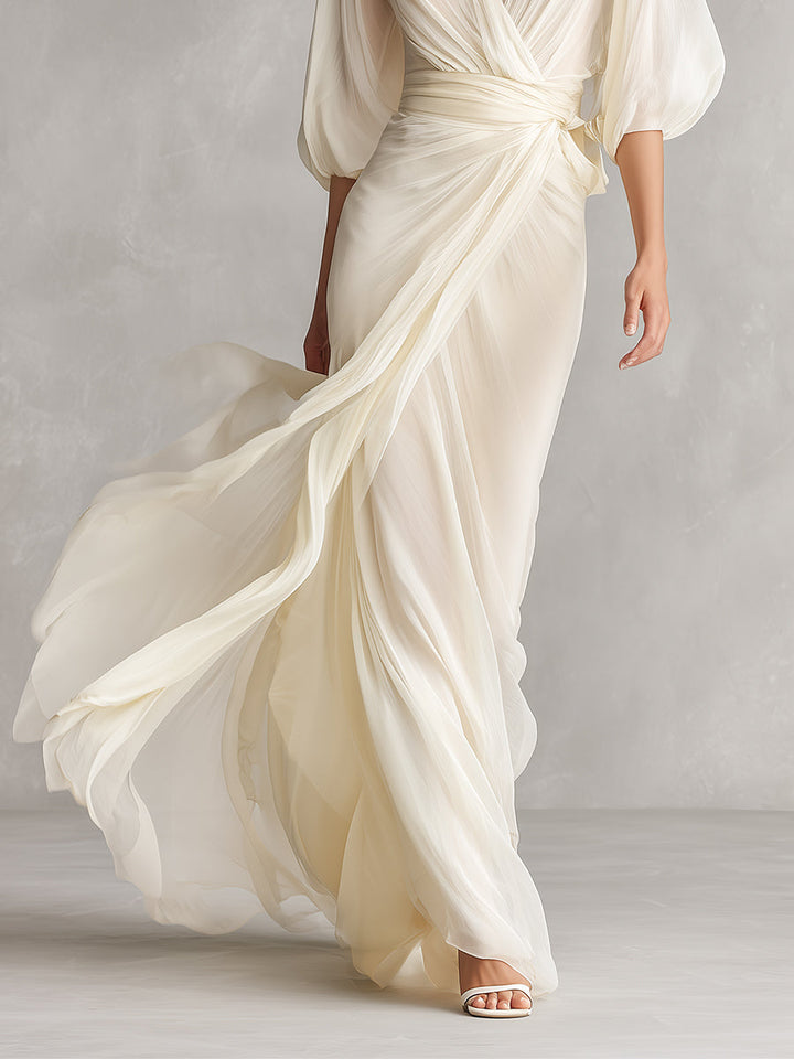 Stunning women's ivory sheer wrap maxi dress, with chic puff sleeves, a perfect formal or evening event outfit.