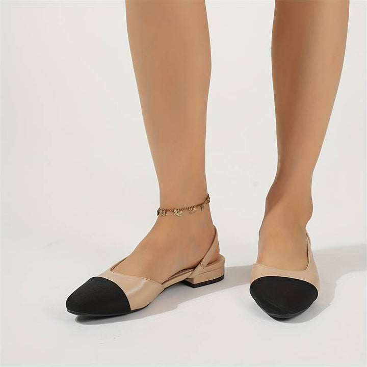Chic women's ballerinas in beige & black, classic slingback design for versatile style.