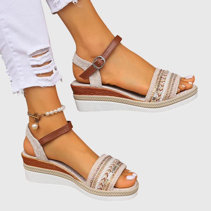 Women's orthopedic summer sandals with arch support. Comfortable flat casual footwear with adjustable straps.