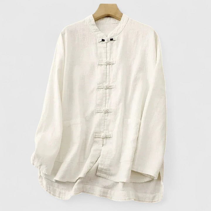 Stylish women's relaxed fit shirt featuring unique knot detail & patch pockets, ideal for versatile spring/summer fashion.