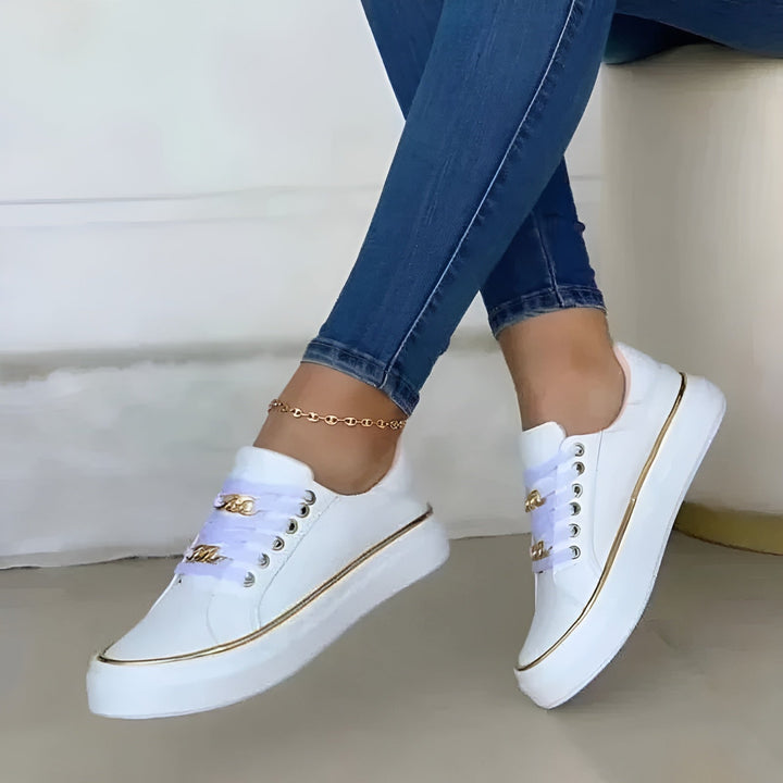 Women's fashion sneakers: stylish lace-up trainers with gold accents & orthopaedic comfort for daily activities.