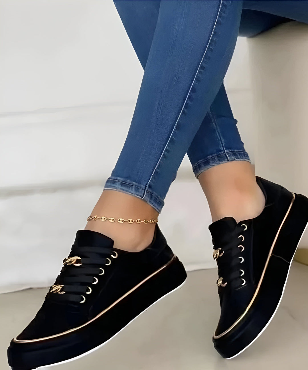 Stylish women's trainers featuring gold accents. Fashionable orthopaedic sneakers with superior comfort for casual wear.