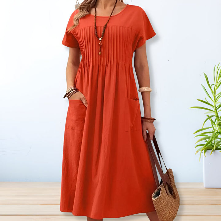 Comfortable women's short sleeve day dress with tummy coverage and pockets, ideal for spring & summer.