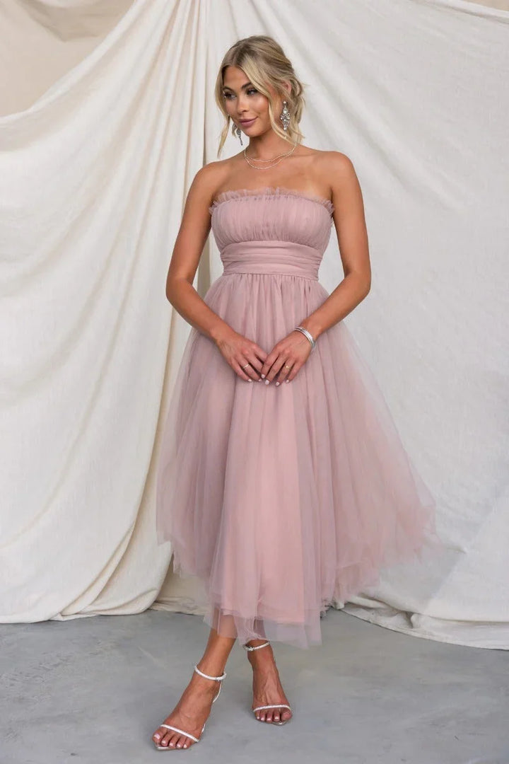 Elegant strapless maxi dress for women. Perfect as a wedding guest dress or formal evening gown.