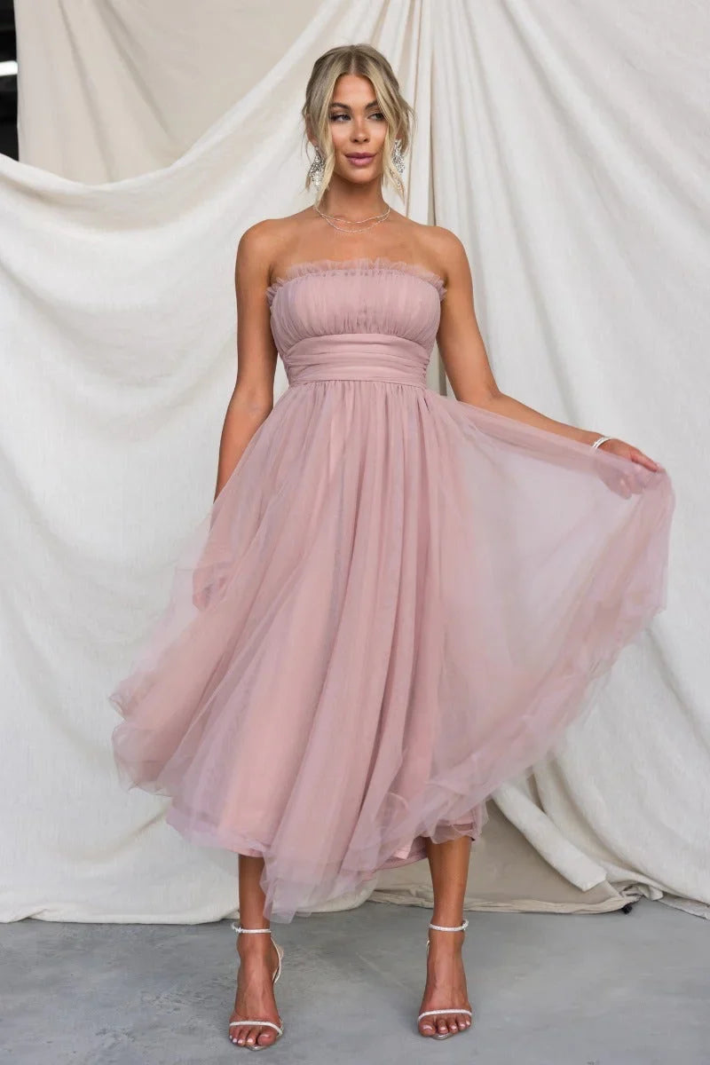 Vibrant yellow strapless maxi dress, a flattering long evening gown for women's formal events.