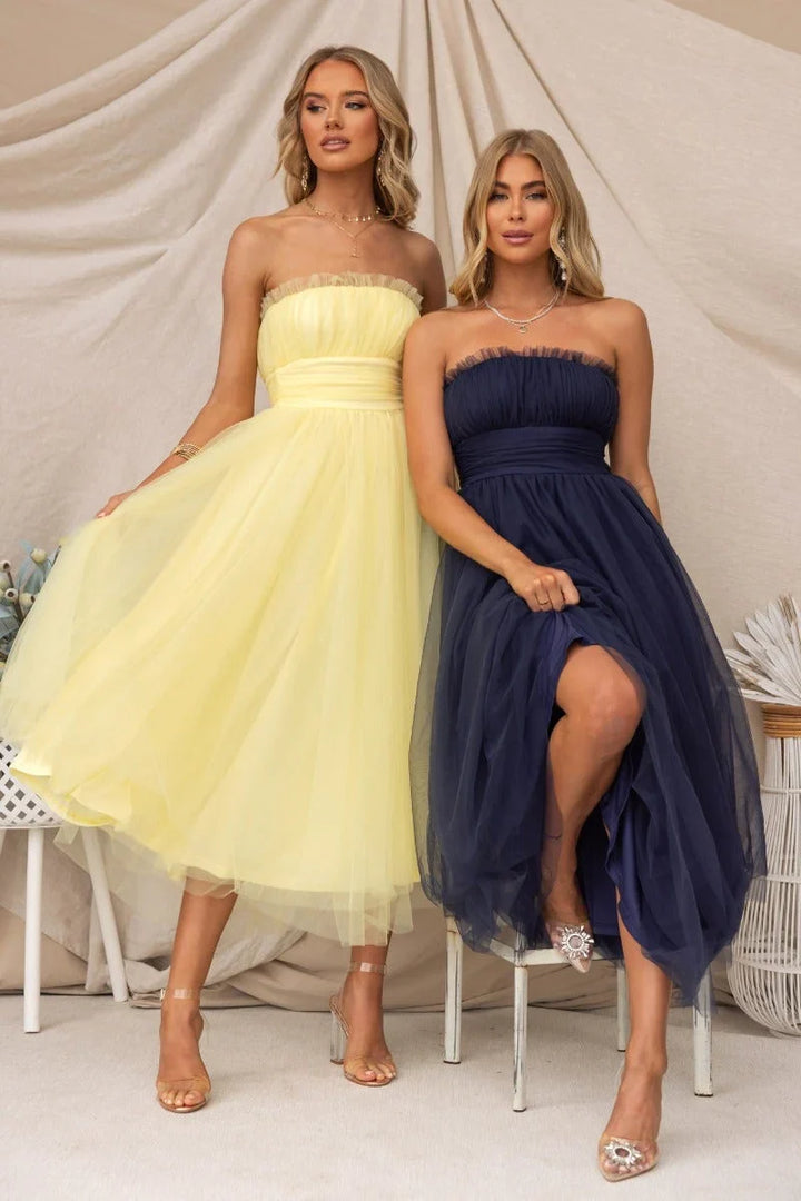 Sophisticated women's elegant strapless maxi dress, a flattering formal gown for any special event.