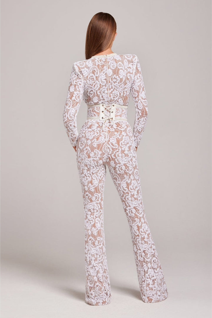Women's lace jumpsuit with sheer long sleeves & wide leg silhouette. Elegant, sophisticated for cocktail events.