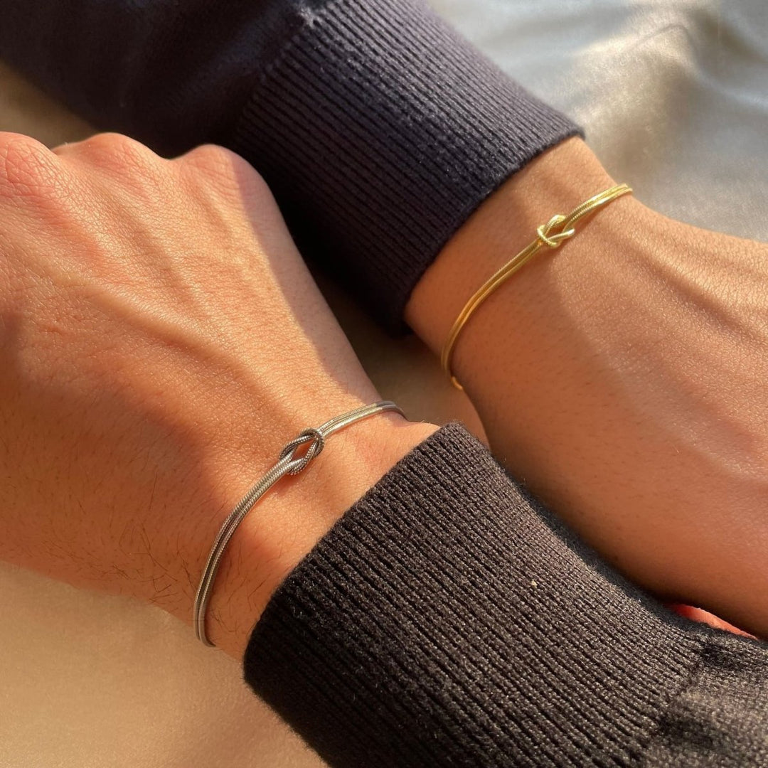 Close-up of a women's love knot bracelet, showcasing its elegant design.