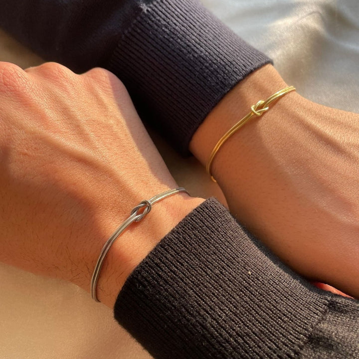 Close-up of a women's love knot bracelet, showcasing its elegant design.