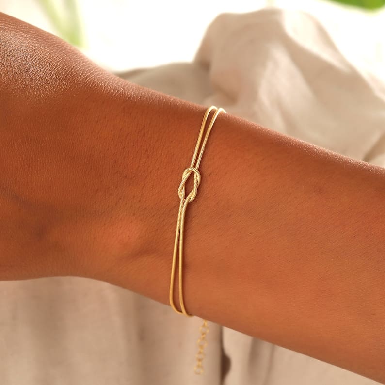 Women's elegant love knot bracelet, a timeless fashion accessory.