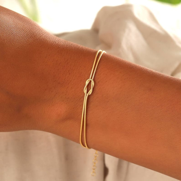 Women's elegant love knot bracelet, a timeless fashion accessory.