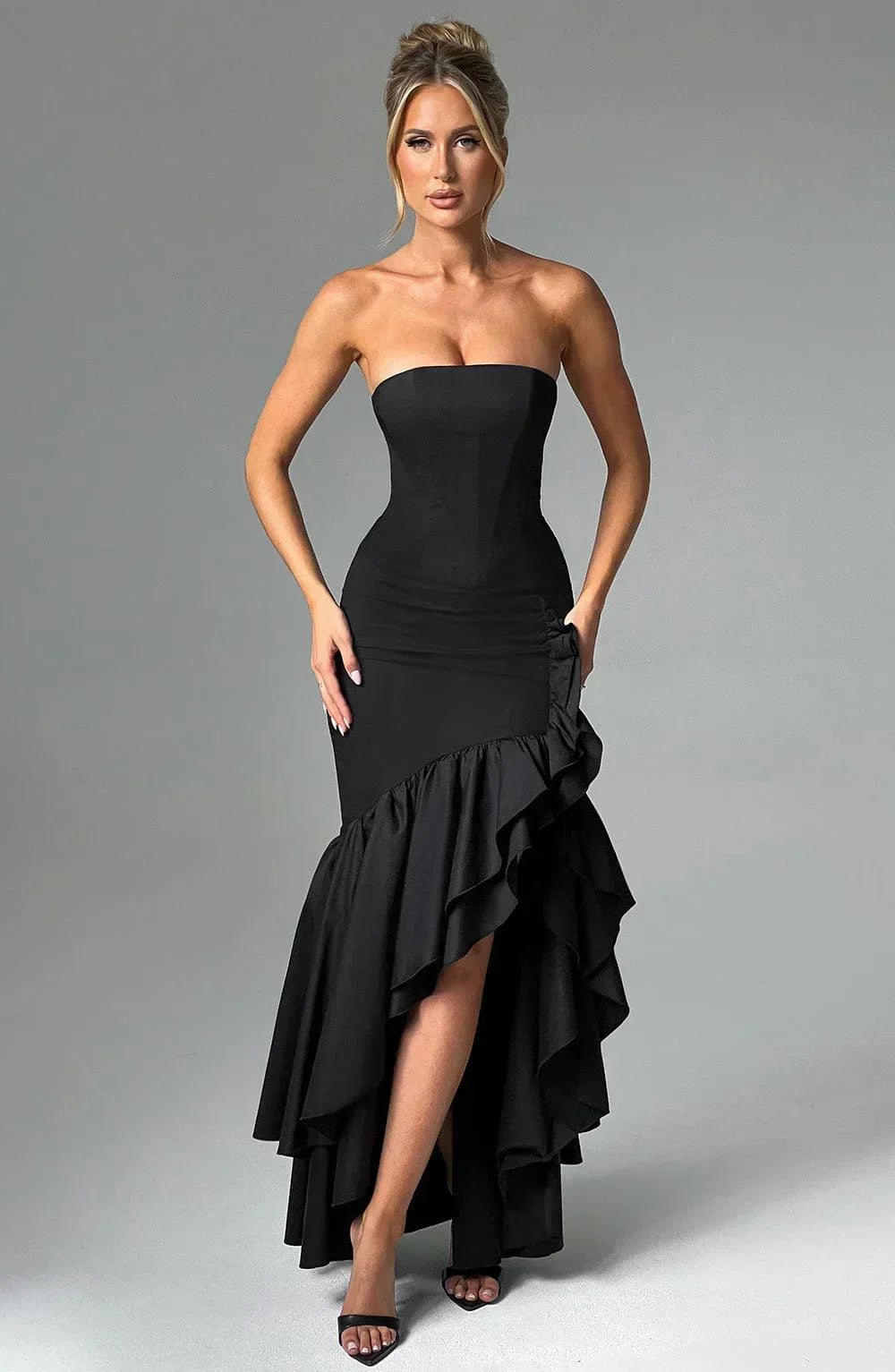 Stylish women's sleeveless maxi dress with charming ruffles & a chic leg slit for wedding guests.