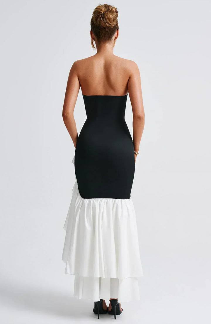Beautiful sleeveless ruffle maxi dress for women, featuring a stylish slit. Perfect for summer events.