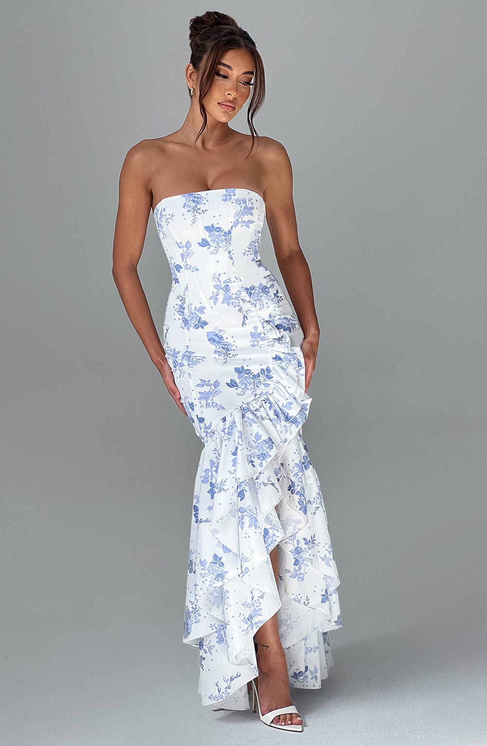 Chic women's evening gown: sleeveless, ruffled maxi dress with a flattering slit design.