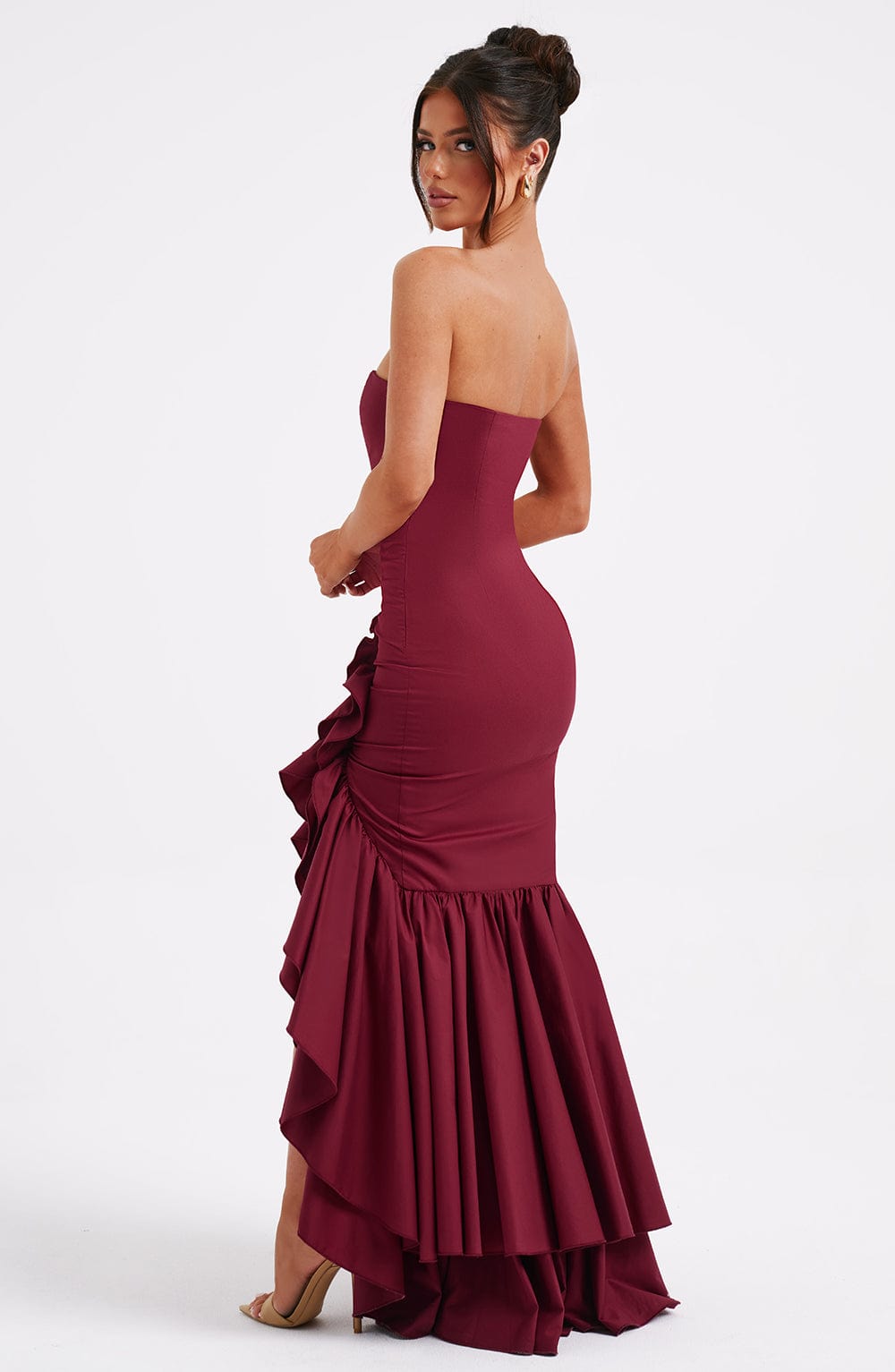 Beautiful women's elegant sleeveless ruffle maxi dress with a flattering slit, perfect for evening.